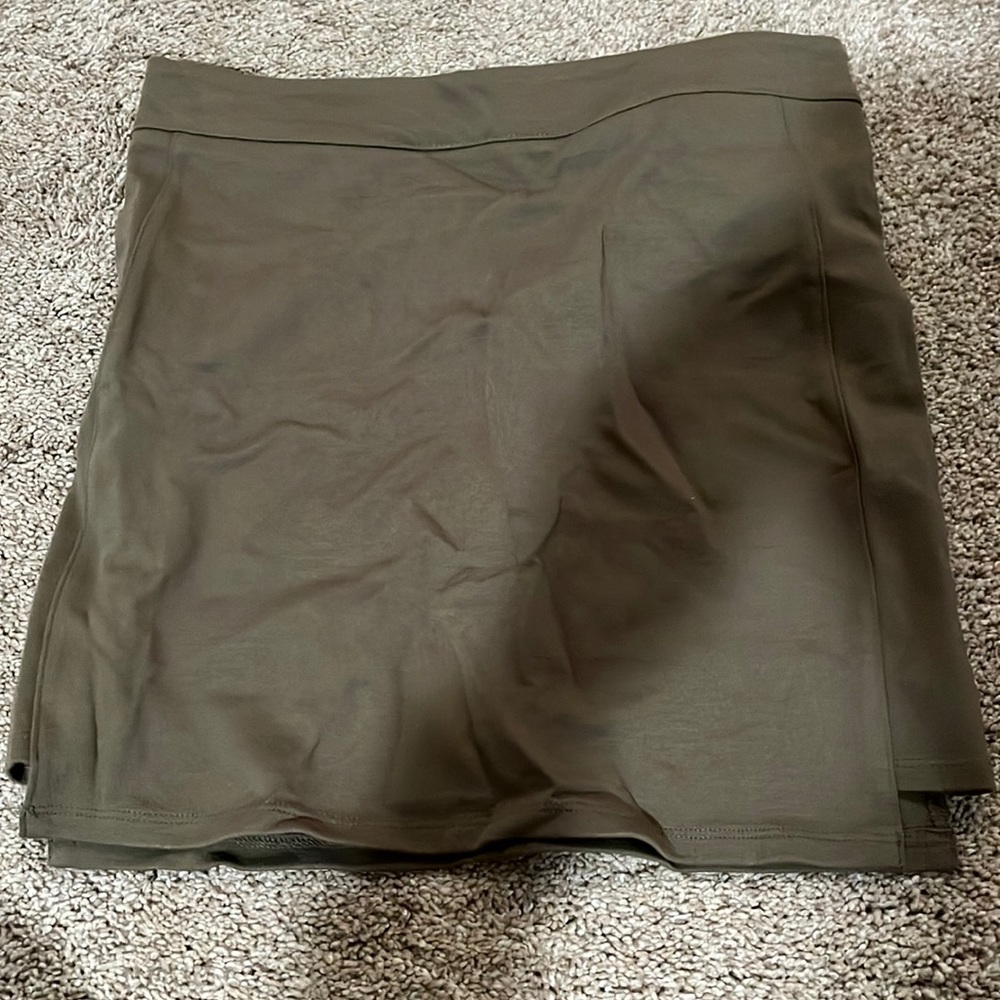 Olive green tight fitted skirt. Worn once and is in perfect condition.